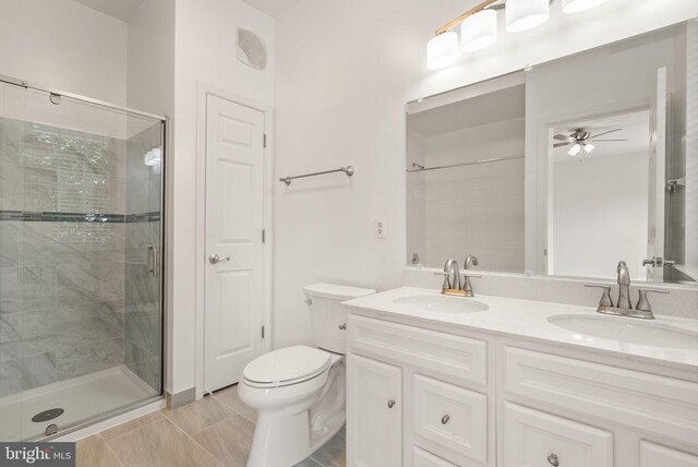 13800 Breezy Ridge Way Unit 101, Woodbridge, VA 22191 - full bathroom with a stall shower, double vanity, toilet, a ceiling fan, and tile patterned flooring