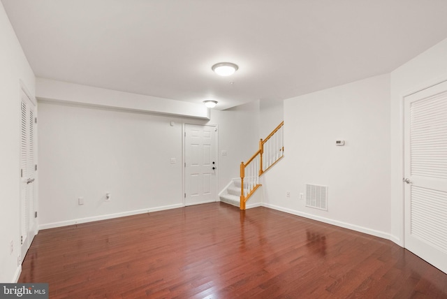 13800 Breezy Ridge Way Unit 101, Woodbridge, VA 22191 - below grade area with stairs, wood finished floors, and baseboards