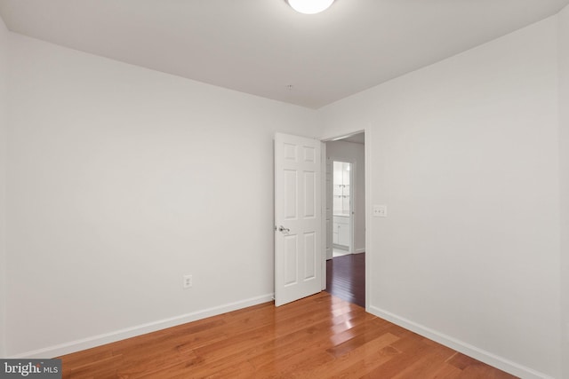 13800 Breezy Ridge Way Unit 101, Woodbridge, VA 22191 - unfurnished room with light wood finished floors and baseboards