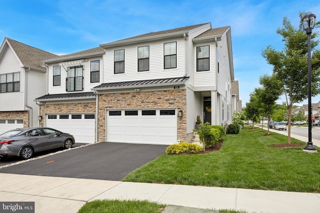 131 Junction Rd, Media, PA 19063 - townhome / multi-family property featuring a standing seam roof, driveway, an attached garage, a front lawn, and stone siding