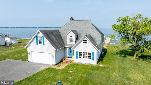 1702 Ferry Point Ct, Trappe, MD 21673 - traditional-style house with a water view, asphalt driveway, a front lawn, and a shingled roof
