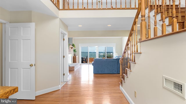 1702 Ferry Point Ct, Trappe, MD 21673 - hall with stairs, light wood finished floors, baseboards, and recessed lighting