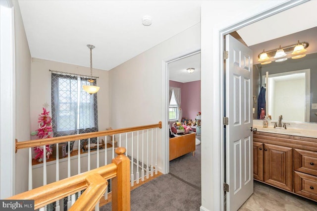 186 Brush Dr, Martinsburg, WV 25405 - hallway featuring a sink and an upstairs landing