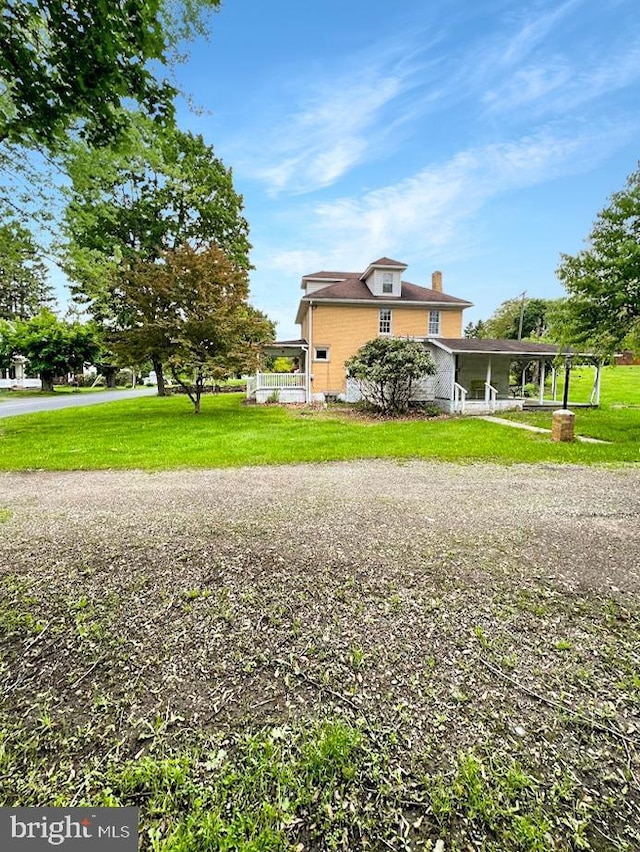873 Maple St, Lanse, PA 16849 - view of side of home featuring a chimney and a yard