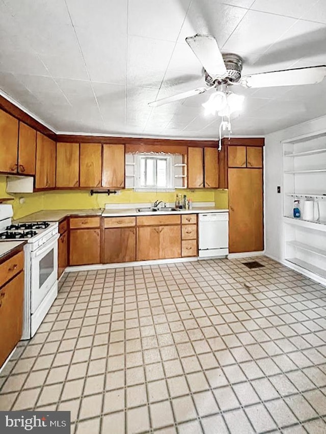 873 Maple St, Lanse, PA 16849 - kitchen featuring white appliances, ceiling fan, a sink, and brown cabinets