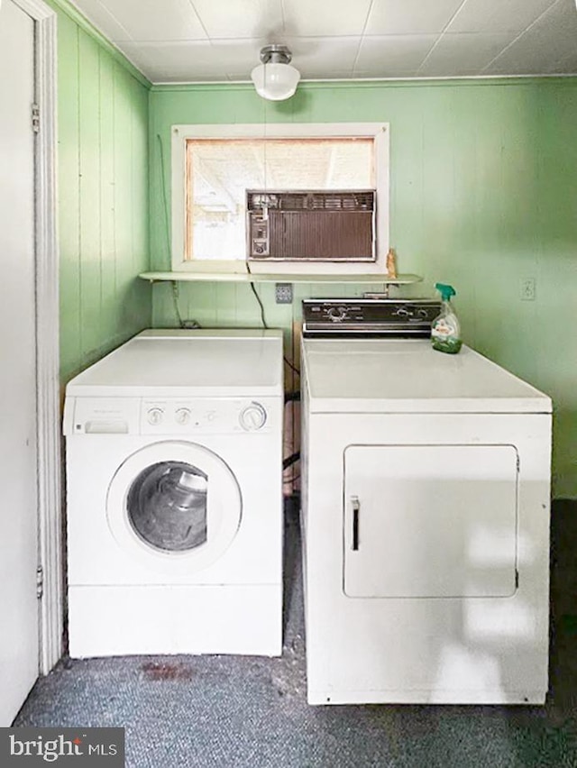 873 Maple St, Lanse, PA 16849 - laundry area with washer and dryer and wood walls