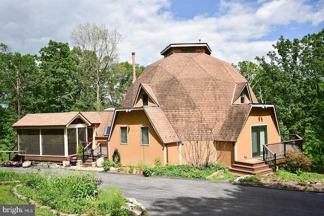 4027 Trego Mountain Rd, Keedysville, MD 21756 - view of front of property with a sunroom, a shingled roof, and a wooden deck