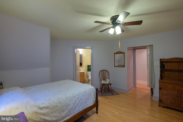4027 Trego Mountain Rd, Keedysville, MD 21756 - bedroom featuring light wood-style flooring, baseboards, a ceiling fan, and connected bathroom