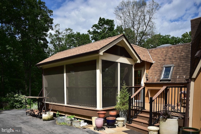 4027 Trego Mountain Rd, Keedysville, MD 21756 - view of side of home with a sunroom and a shingled roof
