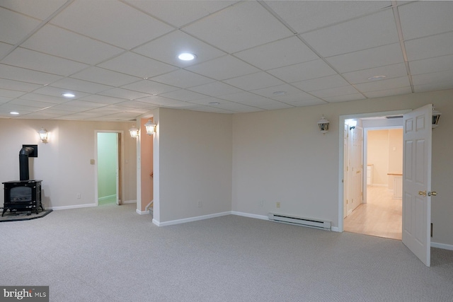 4027 Trego Mountain Rd, Keedysville, MD 21756 - below grade area with baseboard heating, a wood stove, carpet flooring, recessed lighting, and baseboards