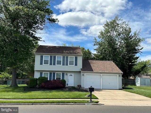 657 S Queen Anne Dr, Fairless Hills, PA 19030 - colonial-style house featuring an attached garage and concrete driveway