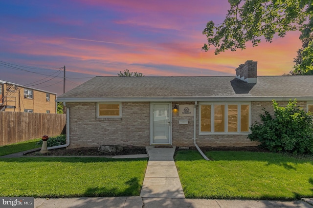 230 N Harrison St, Palmyra, PA 17078 - single story home featuring brick siding, a chimney, and roof with shingles