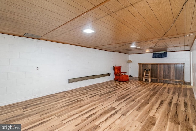 230 N Harrison St, Palmyra, PA 17078 - finished basement with wood finished floors, concrete block wall, and wooden ceiling