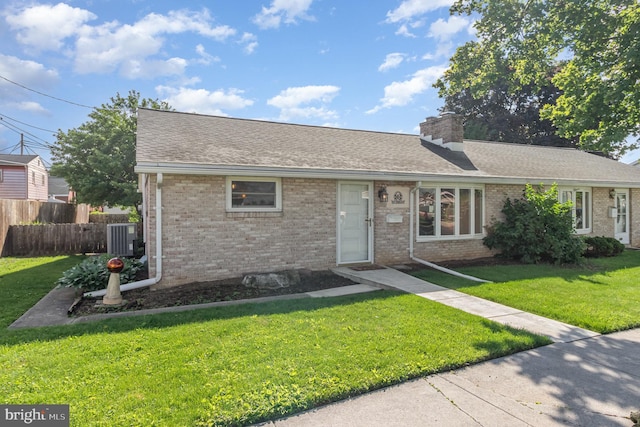 230 N Harrison St, Palmyra, PA 17078 - ranch-style house featuring brick siding, a chimney, central air condition unit, and a shingled roof