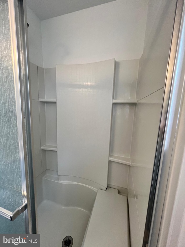 bathroom with a stall shower
