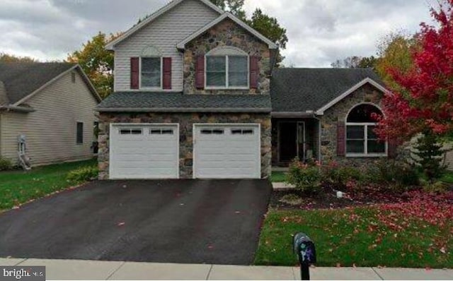 105 Hilltop Ct, Camp Hill, PA 17011 - view of front of home featuring stone siding, driveway, and a garage