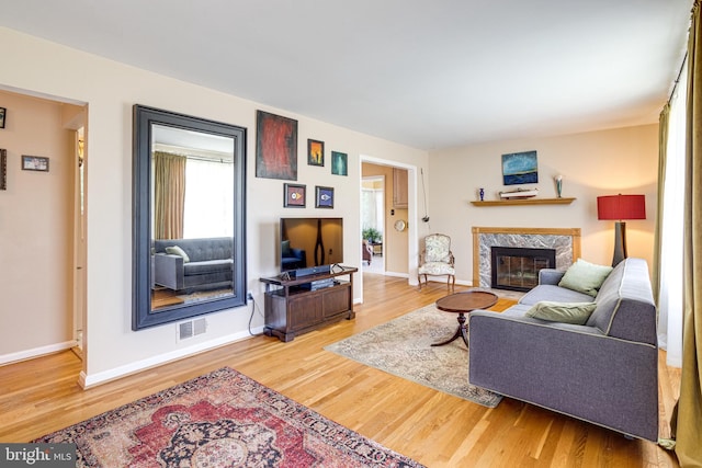 5518 Kempton Dr, Springfield, VA 22151 - living area with a fireplace, wood finished floors, and baseboards
