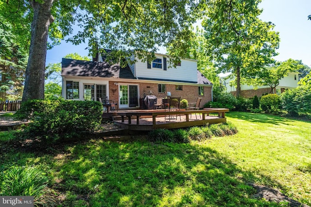 5518 Kempton Dr, Springfield, VA 22151 - back of property with brick siding, a wooden deck, and a lawn