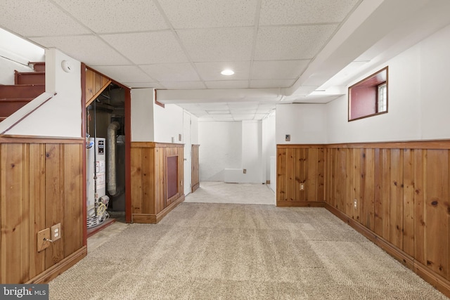 4022 Evans Ln, Drexel Hill, PA 19026 - finished basement featuring a paneled ceiling, light colored carpet, wainscoting, gas water heater, and wood walls