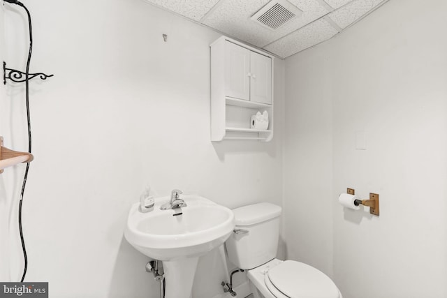4022 Evans Ln, Drexel Hill, PA 19026 - bathroom featuring a paneled ceiling, toilet, and a sink