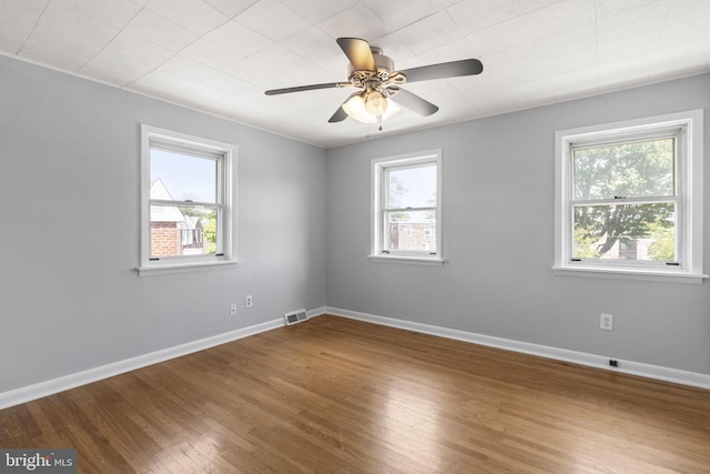 4022 Evans Ln, Drexel Hill, PA 19026 - unfurnished room with healthy amount of natural light, wood finished floors, baseboards, and a ceiling fan