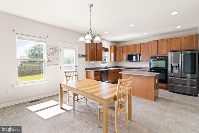 30 Ivy Spring Ln, Fredericksburg, VA 22406 - kitchen featuring appliances with stainless steel finishes, a center island, a sink, recessed lighting, and brown cabinets