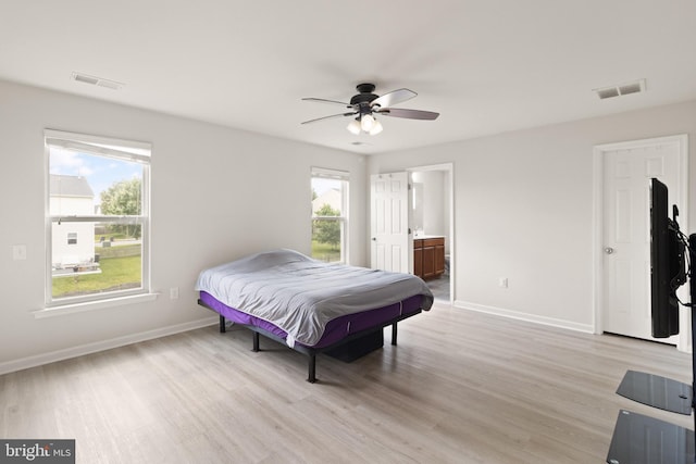 30 Ivy Spring Ln, Fredericksburg, VA 22406 - bedroom with multiple windows, light wood-style floors, and baseboards