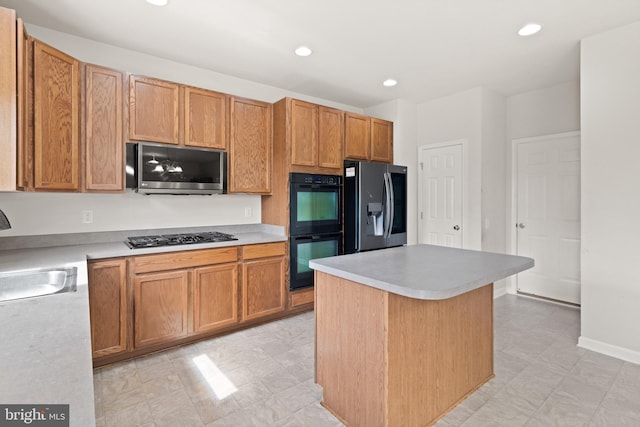 30 Ivy Spring Ln, Fredericksburg, VA 22406 - kitchen featuring black appliances, a sink, light countertops, a kitchen island, and recessed lighting