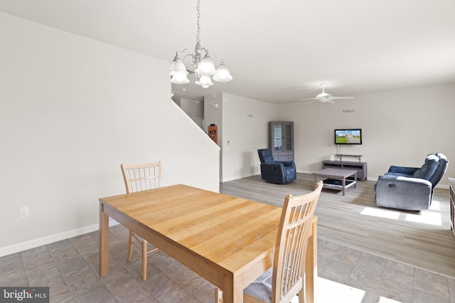 30 Ivy Spring Ln, Fredericksburg, VA 22406 - dining area featuring baseboards, a chandelier, ceiling fan, and stone finish flooring