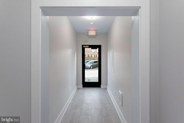 2209 M St NE Unit 3, Washington, DC 20002 - doorway to outside with baseboards and light wood-style floors