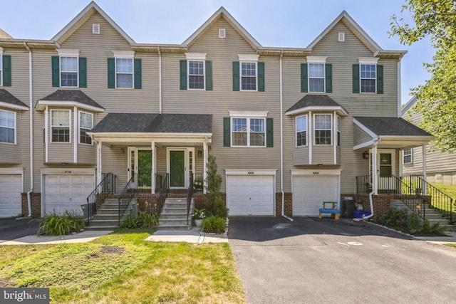 515 Williamsburg Way, King Of Prussia, PA 19406 - view of property featuring driveway, a garage, and brick siding
