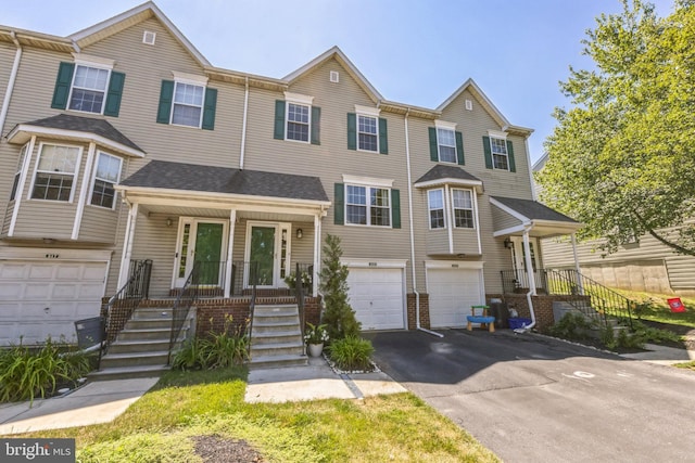 515 Williamsburg Way, King Of Prussia, PA 19406 - townhome / multi-family property with driveway, an attached garage, and a porch
