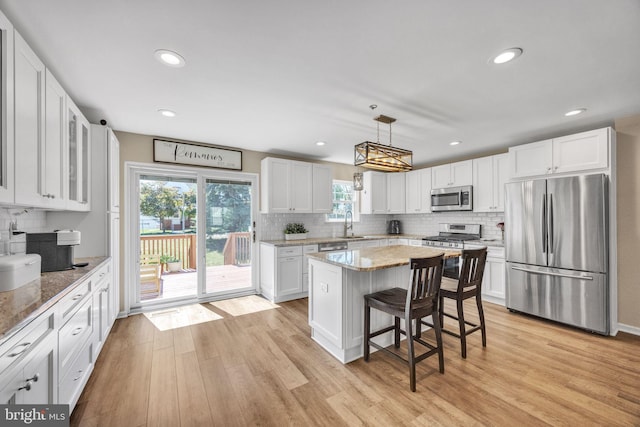 515 Williamsburg Way, King Of Prussia, PA 19406 - kitchen with stainless steel appliances, decorative backsplash, white cabinets, light wood-type flooring, and recessed lighting