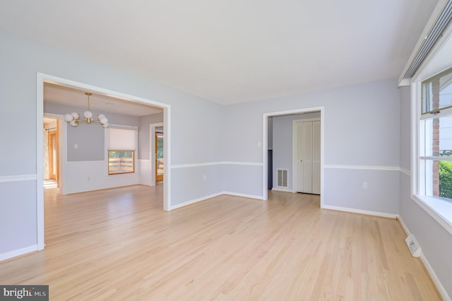 1104 Milroy Ct, Winchester, VA 22601 - spare room with a chandelier and light wood-type flooring