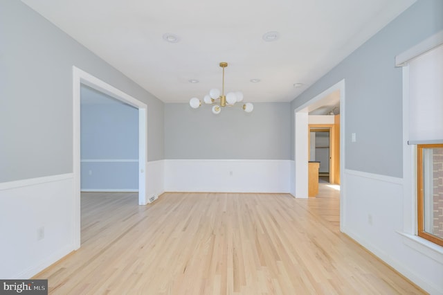 1104 Milroy Ct, Winchester, VA 22601 - empty room featuring a chandelier and wood finished floors