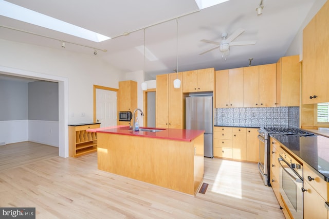 1104 Milroy Ct, Winchester, VA 22601 - kitchen with lofted ceiling, stainless steel appliances, track lighting, light brown cabinets, and light wood finished floors