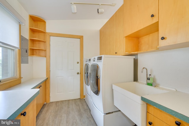 1104 Milroy Ct, Winchester, VA 22601 - laundry area featuring washing machine and clothes dryer, electric panel, light wood-type flooring, and cabinet space