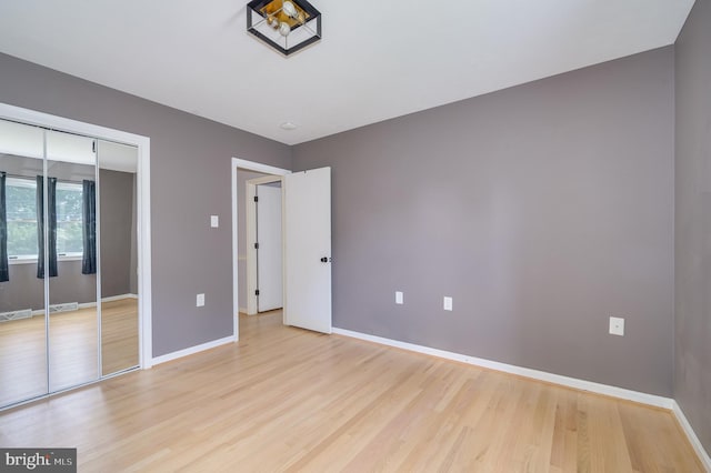 1104 Milroy Ct, Winchester, VA 22601 - unfurnished bedroom featuring light wood-style floors and a closet