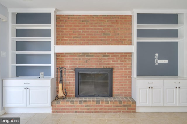 1104 Milroy Ct, Winchester, VA 22601 - unfurnished living room with a fireplace, light tile patterned floors, built in shelves, and crown molding