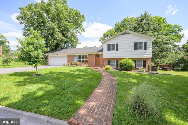 1104 Milroy Ct, Winchester, VA 22601 - split level home featuring brick siding, a garage, driveway, and a front lawn