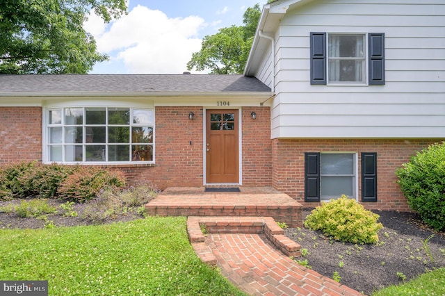 1104 Milroy Ct, Winchester, VA 22601 - view of exterior entry with brick siding and a lawn