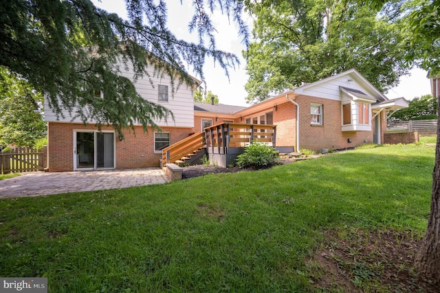1104 Milroy Ct, Winchester, VA 22601 - rear view of house with brick siding, stairs, a patio, and a wooden deck