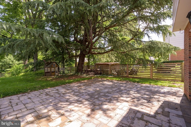 1104 Milroy Ct, Winchester, VA 22601 - fenced backyard with a storage unit and a patio