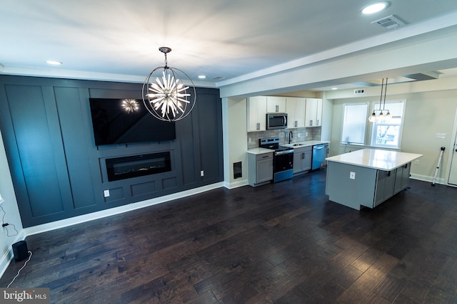 3815 Cottage Ave, Baltimore, MD 21215 - kitchen with a chandelier, stainless steel appliances, a sink, light countertops, and backsplash