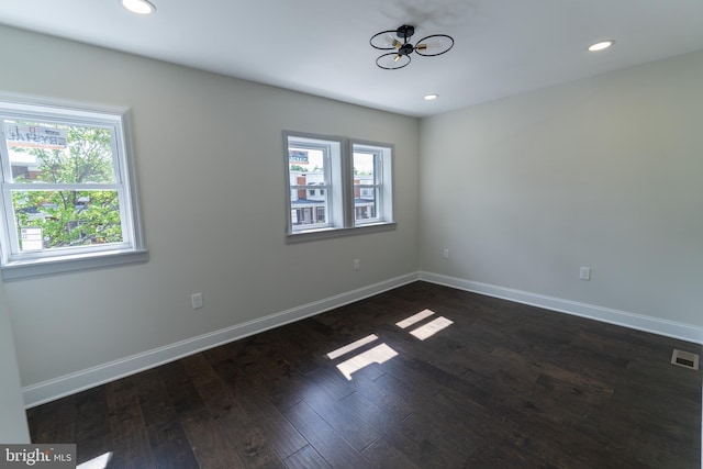 3815 Cottage Ave, Baltimore, MD 21215 - spare room featuring a chandelier, recessed lighting, dark wood-style flooring, and baseboards