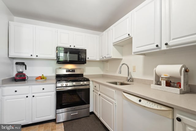 6034 Westchester Park Dr Unit 202, College Park, MD 20740 - kitchen featuring black microwave, stainless steel gas range oven, dishwasher, a sink, and white cabinets
