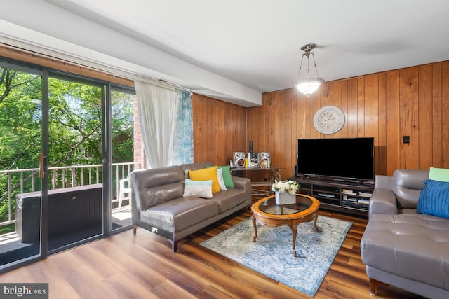 6034 Westchester Park Dr Unit 202, College Park, MD 20740 - living room featuring wooden walls and wood finished floors