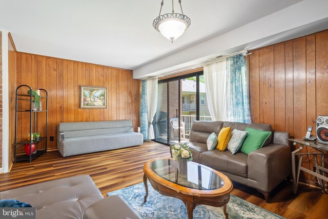 6034 Westchester Park Dr Unit 202, College Park, MD 20740 - living room with wood walls and wood finished floors