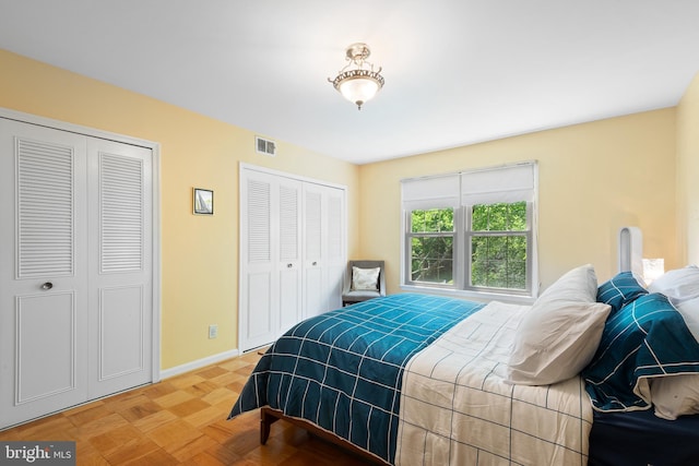 6034 Westchester Park Dr Unit 202, College Park, MD 20740 - bedroom featuring multiple closets and baseboards