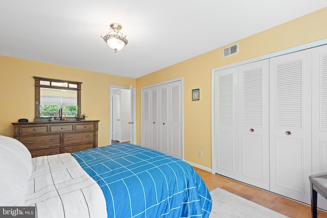 6034 Westchester Park Dr Unit 202, College Park, MD 20740 - bedroom with multiple closets and baseboards